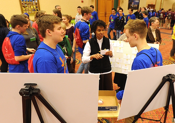 Desire Findlay (center), a Felician Sister of North America, works with students at the 